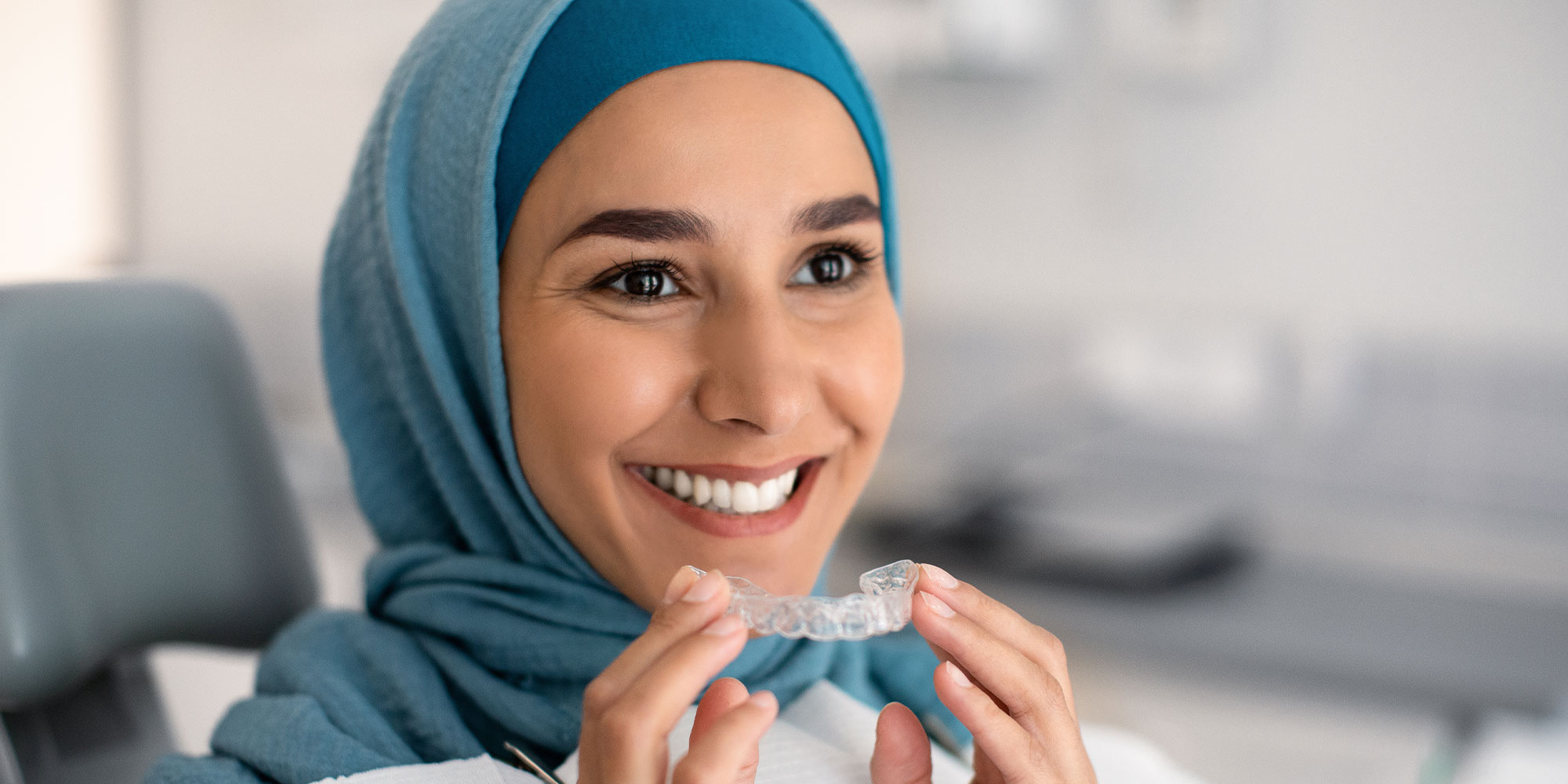 patient putting in their aligners