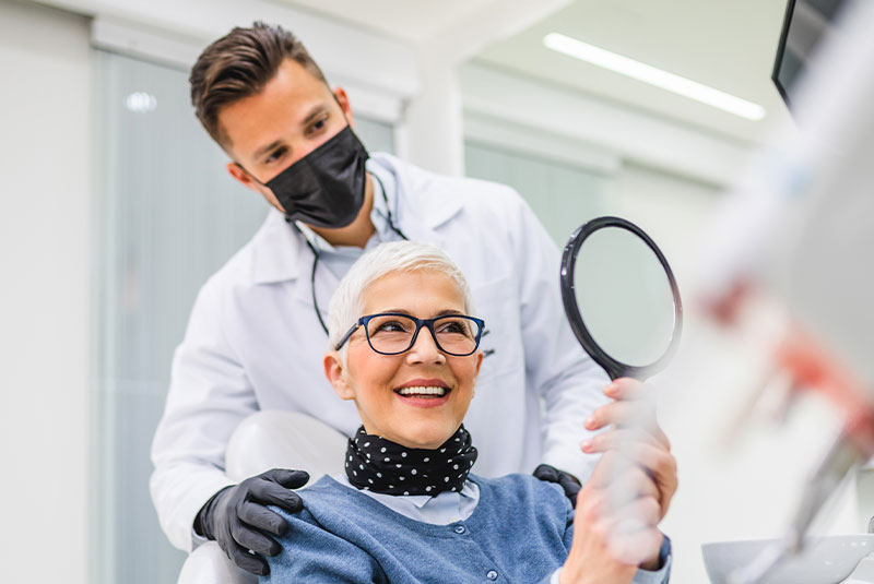 patient smiling after their dental treatment