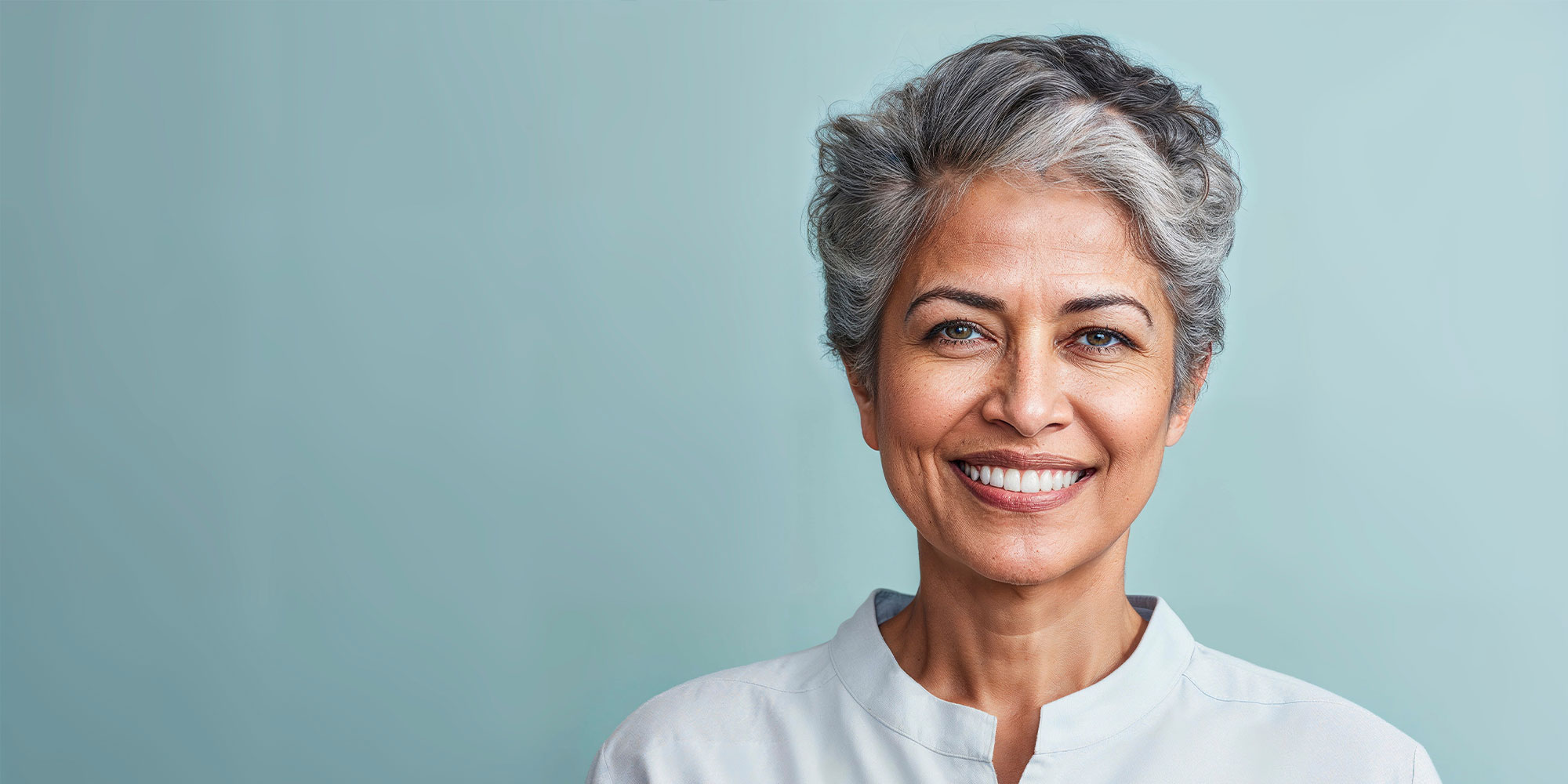Headshot of person smiling brightly
