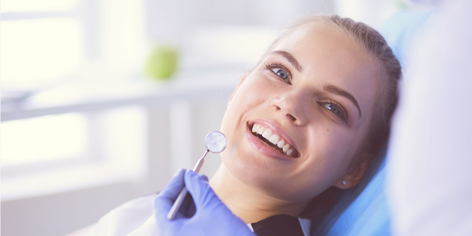patient smiling and ready for dental treatment