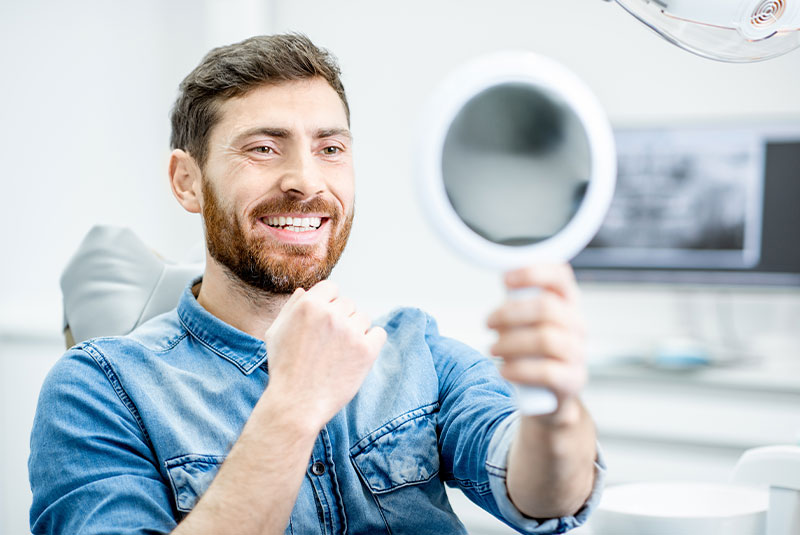 patient smiling brightly after their dental treatment